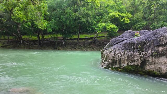 Turquoise Cahabon River with Suspension Bridge in Semuc Champey