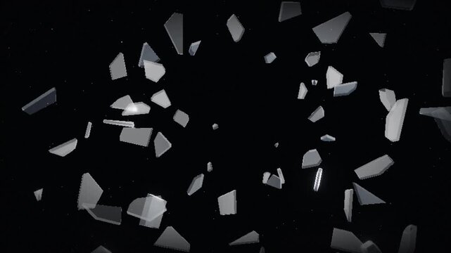 Glass sheet shattering into sharp shards against a black background. 4K video