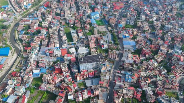 Dense City Settlement with Rooftop Solar Array Aerial Wide Establishing