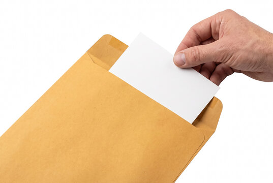 Hand removing a blank white card from a brown manila envelope