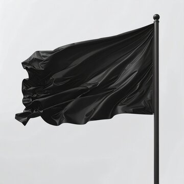 A black flag ripples and waves dynamically against a plain background