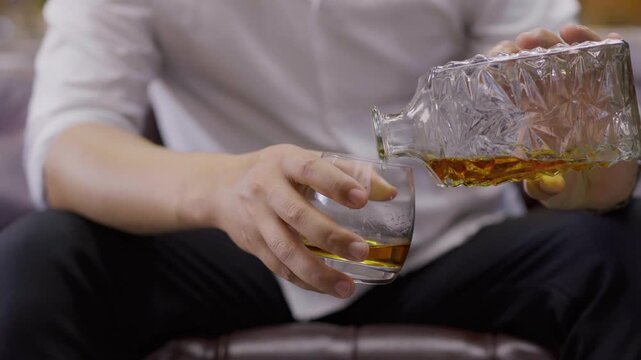 businessman holding whiskey, a restaurant	