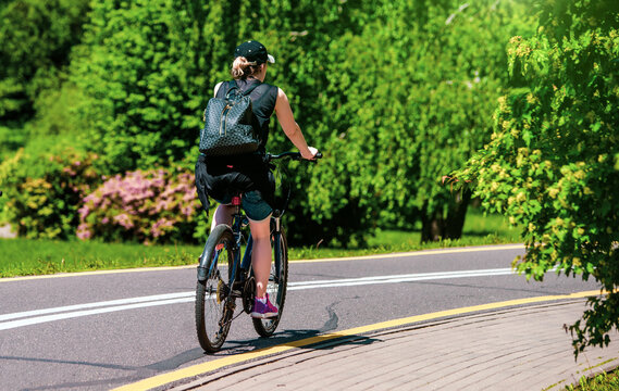 Cyclist ride on the bike path in the city Park
