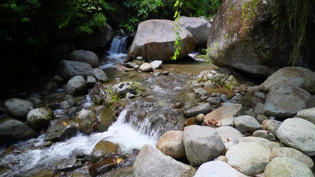 Small Tropical Waterfall Cascading Between Granite Boulders 4K