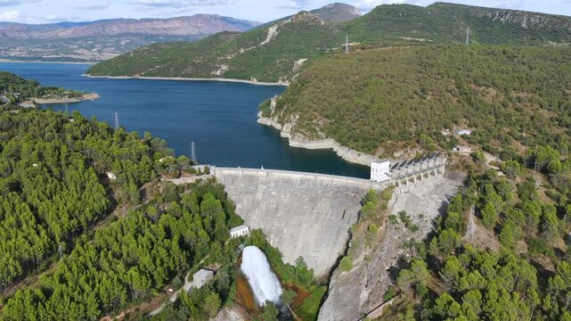 Aerial view of Talarn dam and low water levels at Panta de Sant Antoni reservoir in Spanish Pyrenees, Lleida, Spain