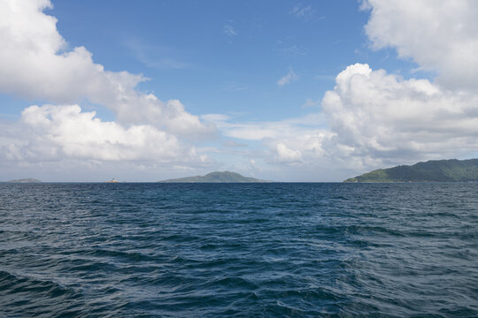 Side view from boat in Indian ocean sailing between Seychelles islands in daytime