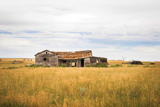 An old abandoned wooden building in a prairie