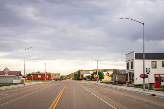 An empty main street in a small rural American town at dusk