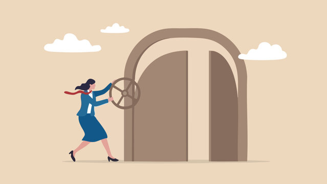 Businesswoman in a blue suit turning a large circular wheel to open a heavy door