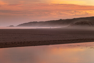 Golden sunset reflection on sandy beach in Cadiz coastline Spain © Paolo Corazza