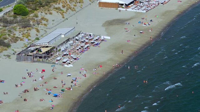 Aerial view of people swimming and relaxing on the beach in La Grande-Motte, H&eacute;rault, South of France