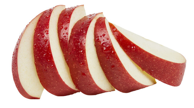 Fresh red apple slices with water droplets arranged in a row