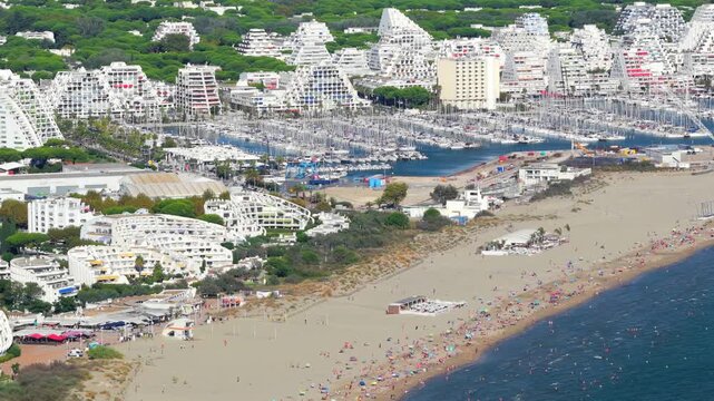 Aerial view of people swimming and relaxing on the beach in La Grande-Motte, H&eacute;rault, South of France