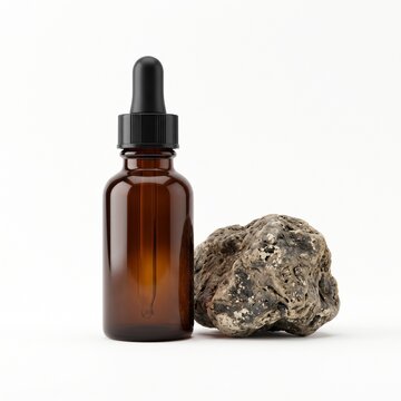 Ambergris Tincture Bottle and Raw Ambergris on White