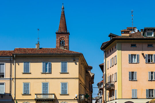 Bell tower of the Chiesa di Santa Maria del Carmine framed by the Via XX Settembre in Pavia from the Piazza del Duomo