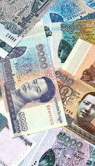 Cambodian riel money banknotes bunch on table. Cambodia bills of KHR currency close up © Larysa