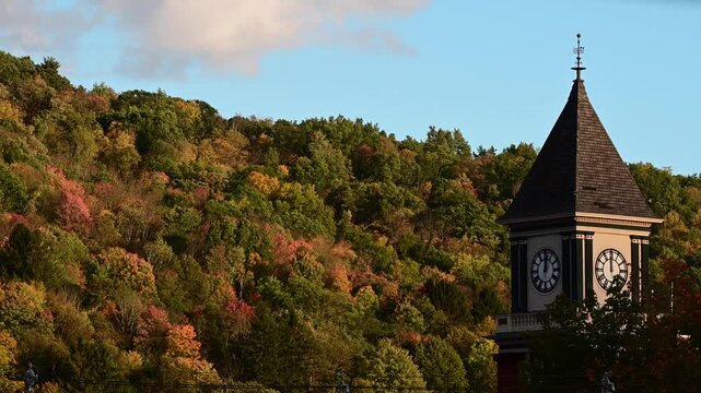 clock tower fall background dramatic light moving trees golden hour