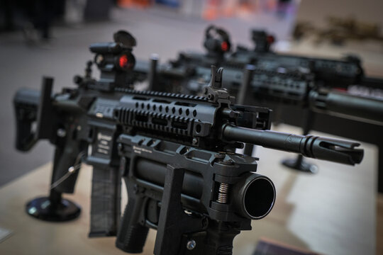 Close up of an assault rifle and its grenade launcher at a defence trade fair near Paris, France