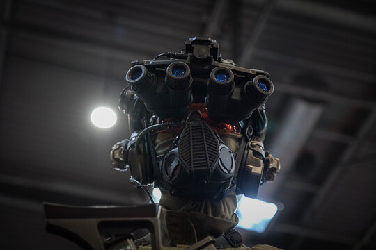Weapon optics catching the light of the exhibition hall at a defence trade fair near Paris, France