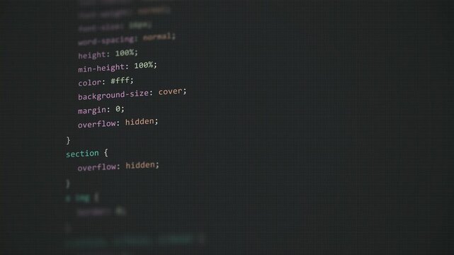 CSS Web Design Style Sheet Code Scrolling on Dark Pixelated Computer Screen