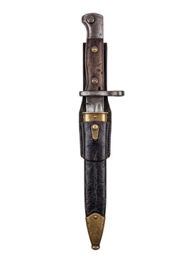 Vintage military bayonet with wooden handle and leather scabbard on transparent background