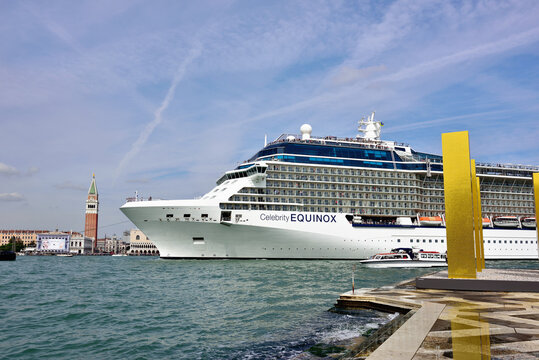 Venice, Italy - Sept 24, 2014: The cruise ship Celebrity Equinox crosses the Venetian Lagoon at morning. More than 10 million tourists visit Venice every year