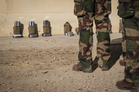 Mess tins lined up against a wall at the Foreign Legion training regiment in Castelnaudary, France