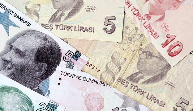 Turkish lira money bills in pile on table. Turkey TRY currency cash close up