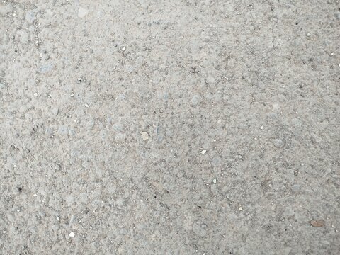 Dry ground texture featuring faint tire track