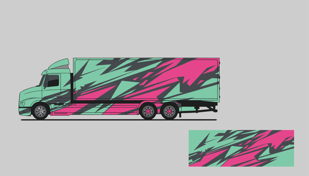 Side view of a modern semi truck with striking geometric teal and pink racing decals on a grey background.