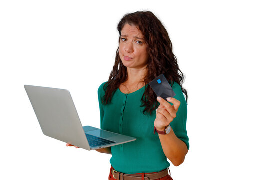 Woman experiencing financial stress while online shopping with a laptop and credit card, facing debt or bankruptcy