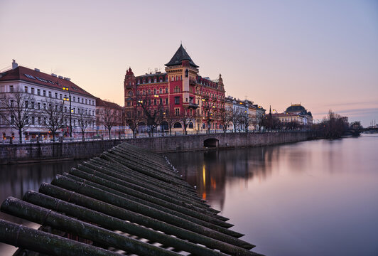 Timber weir and Smetana Embankment in Prague at twilight
