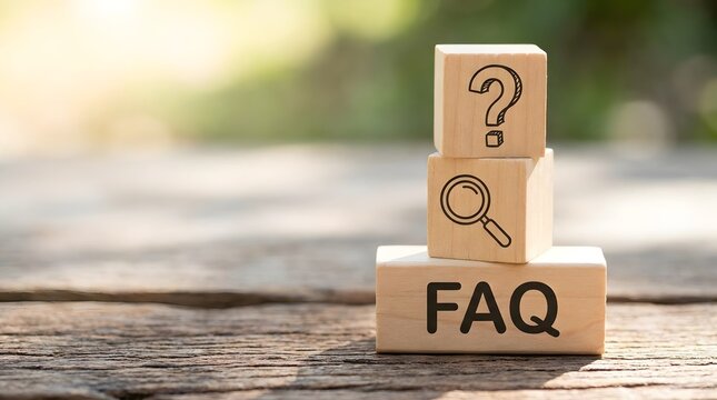 Wooden blocks with FAQ, a magnifying glass, and a question mark symbolizing customer service and information seeking.