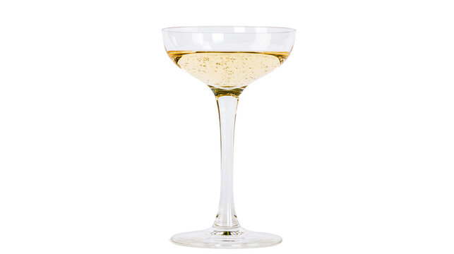 Elegant crystal coupe glass filled with sparkling golden champagne