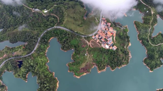 Guatap&eacute; and El Pe&ntilde;&oacute;n de Guatap&eacute; Surrounded by Reservoir Islands in Antioquia, Colombia. Time Lapse. Establishing Shot. Aerial View.