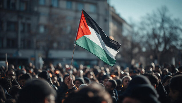 Palestinian Flag Waving Above Crowd at Street Protest
