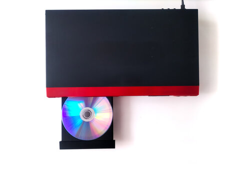 Close up of DVD player with ejected disc tray isolated on white background