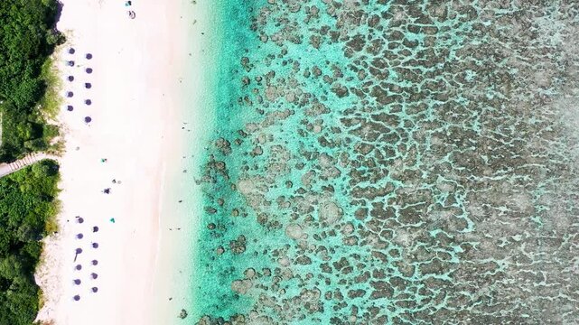 Drone flight across Yoshino Beach and coral reef Miyakojima Japan
