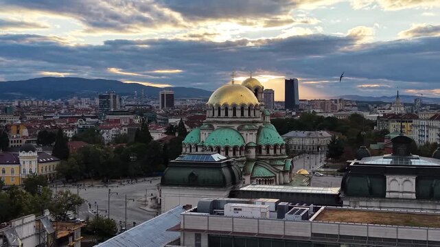 Aerial footage of Sofia city skyline and cathedral at sunset, Bulgaria