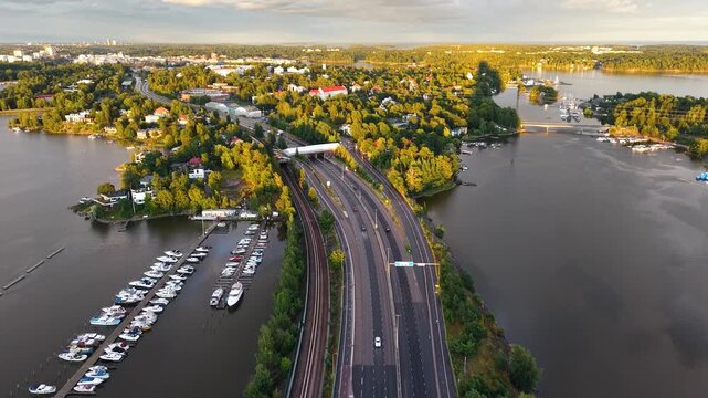 Drone shot of Kulosaari highway and marina bay in Helsinki city, Finland