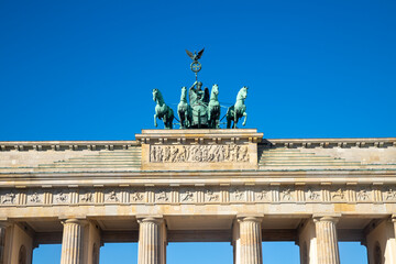 Berlin, Germany  1st October 2026: The iconic Brandenburg Gate in Berlin stands under a clear blue sky on a sunny autumn afternoon © Leckerstudio