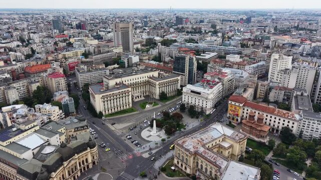 Drone shot of Revolution Square and cityscape in Bucharest city, Romania