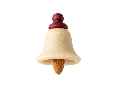 Handcrafted marzipan bell shaped sweet with a central almond clapper on transparent background