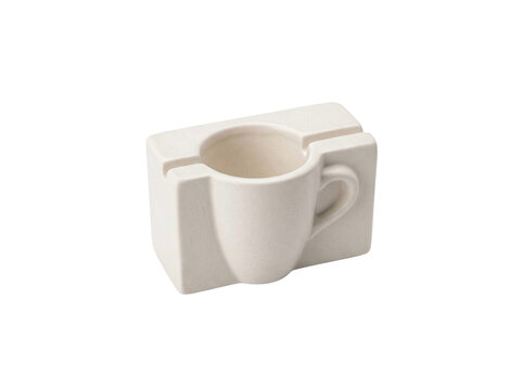 Minimalist ceramic coffee cup integrated into a rectangular block design on transparent background