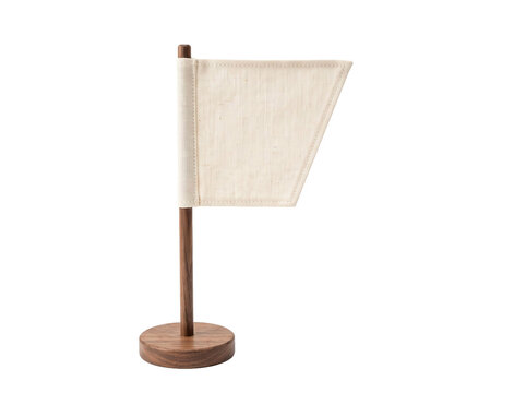 Small blank canvas flag on a wooden stand isolated against a clean transparent background studio shot