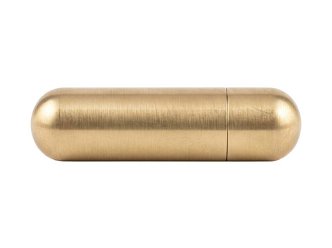 Minimalist brushed brass pill case with a smooth cylindrical shape isolated on transparent background