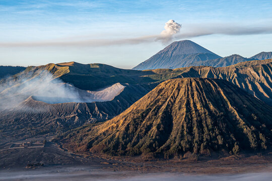 Panoramic view of Mount Bromo crater and smoking Mount Semeru volcano at morning in East Java, Indonesia