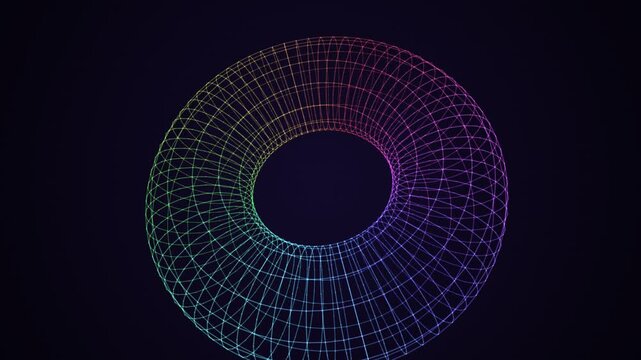 A seamless 3D animation of a colorful wireframe torus rotating on a dark background. Featuring a vibrant rainbow spectrum gradient and intricate geometric mesh design.