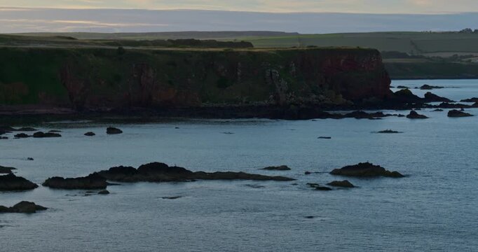 Sunset over rugged coastline of Eyemouth 2