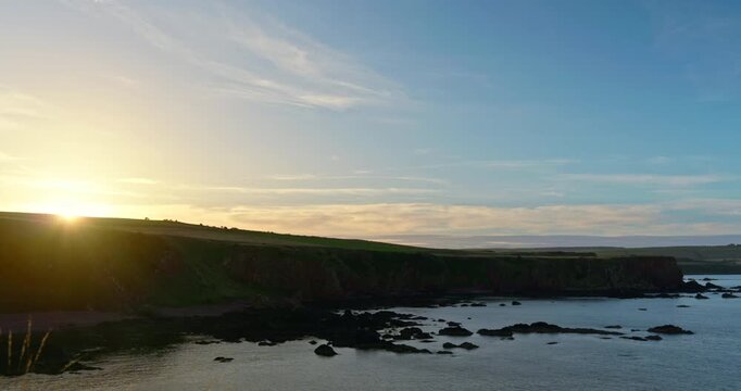 Wide sunset over rugged coastline of Eyemouth
